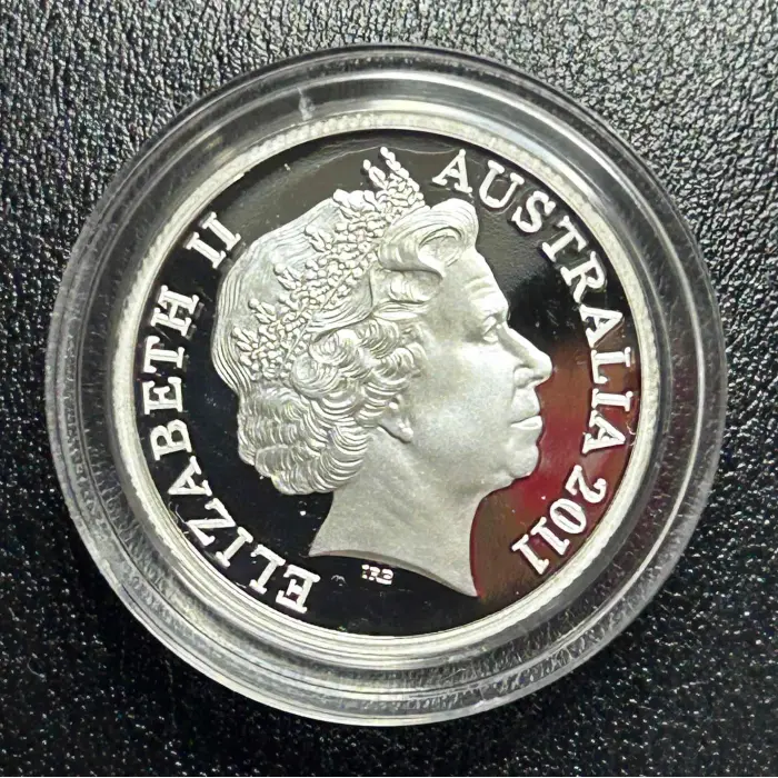2011 RAM’S HEAD DOLLAR $1 “C” MINTMARK SILVER COIN. (CERTIFICATE # 8945)