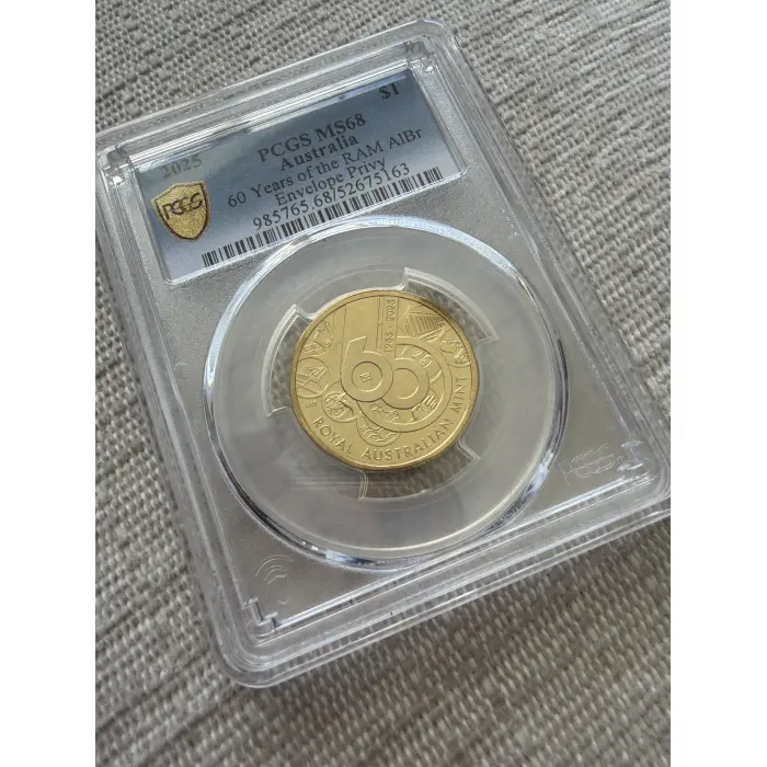 2025-C $1 60 Years of the RAM AlBr Decimal Coin PCGS MS68 (Envelope Privy)