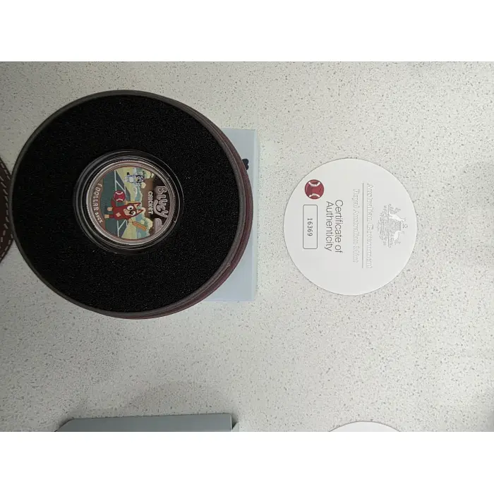 2027 silver proof uncirculated $1 coloured bluey coin.